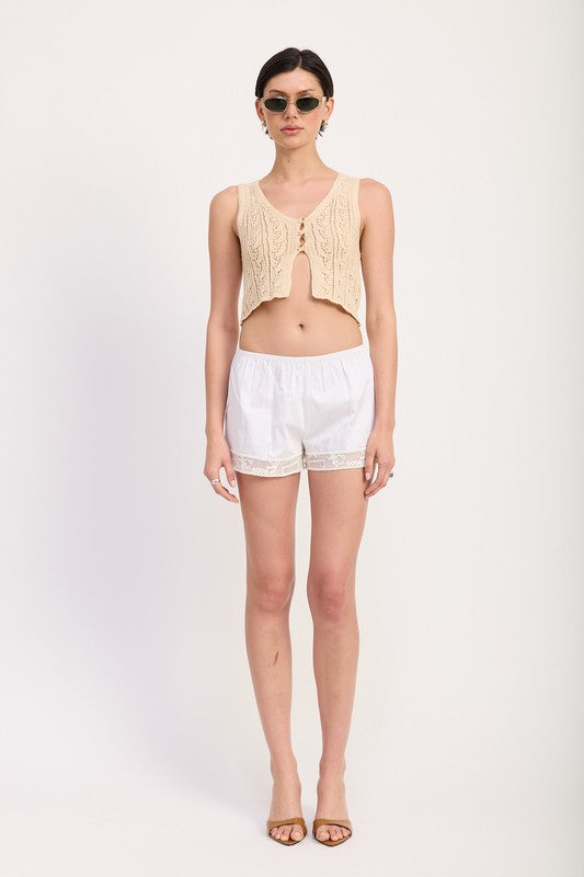 Emory Park Crochet Button Front Vest Top in beige worn with white shorts and sunglasses straight view