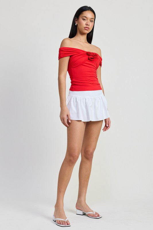 Emory Park Off Shoulder Rosette Top in bright red worn by model with white skirt and sandals