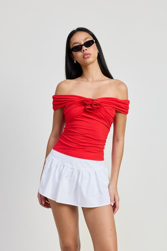 Emory Park Off Shoulder Rosette Top in red worn with white skirt and black sunglasses