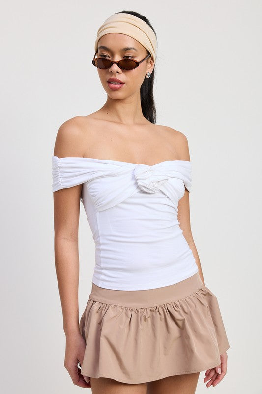 Emory Park Off Shoulder Rosette Top in white worn with beige skirt and accessories