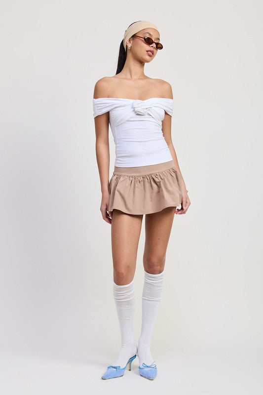 Emory Park Off Shoulder Rosette Top in white worn with tan skirt and blue heels