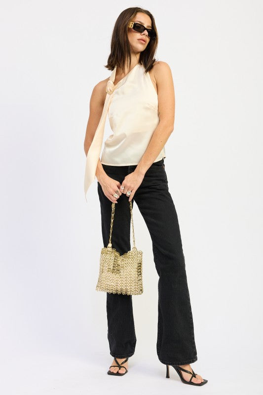 Emory Park One Shoulder Top With Scarf Detail in cream, paired with black jeans and a stylish handbag.