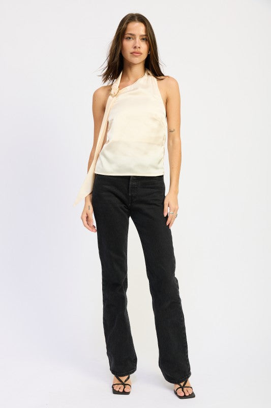 Emory Park One Shoulder Top With Scarf Detail in light color, styled with black pants for a chic look