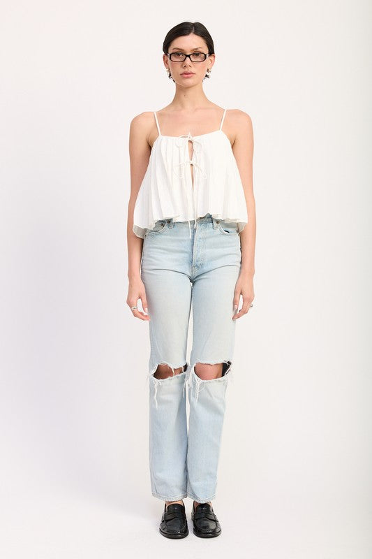 Emory Park white Pleated Tie Front Cami Top paired with light blue ripped jeans and black shoes