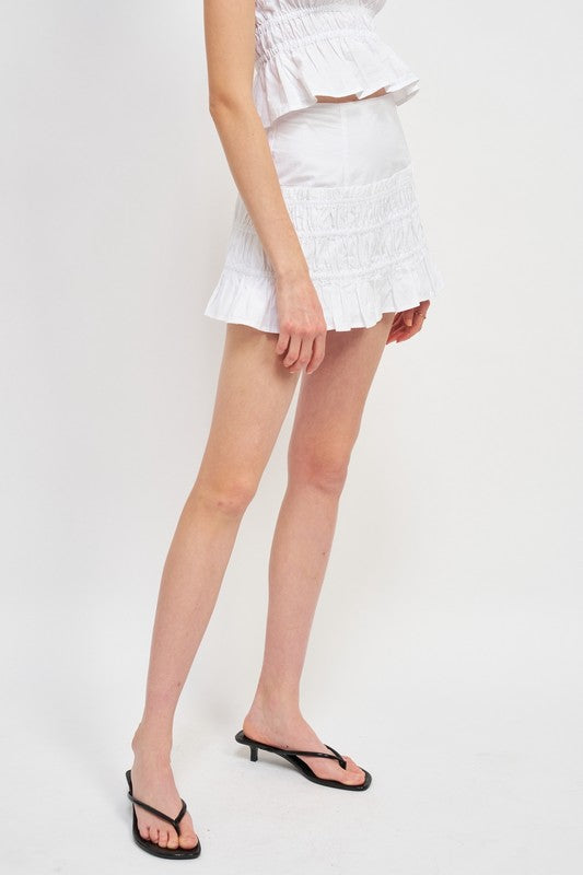 Emory Park white High Waist Gathered Mini Skirt worn with matching top and black sandals